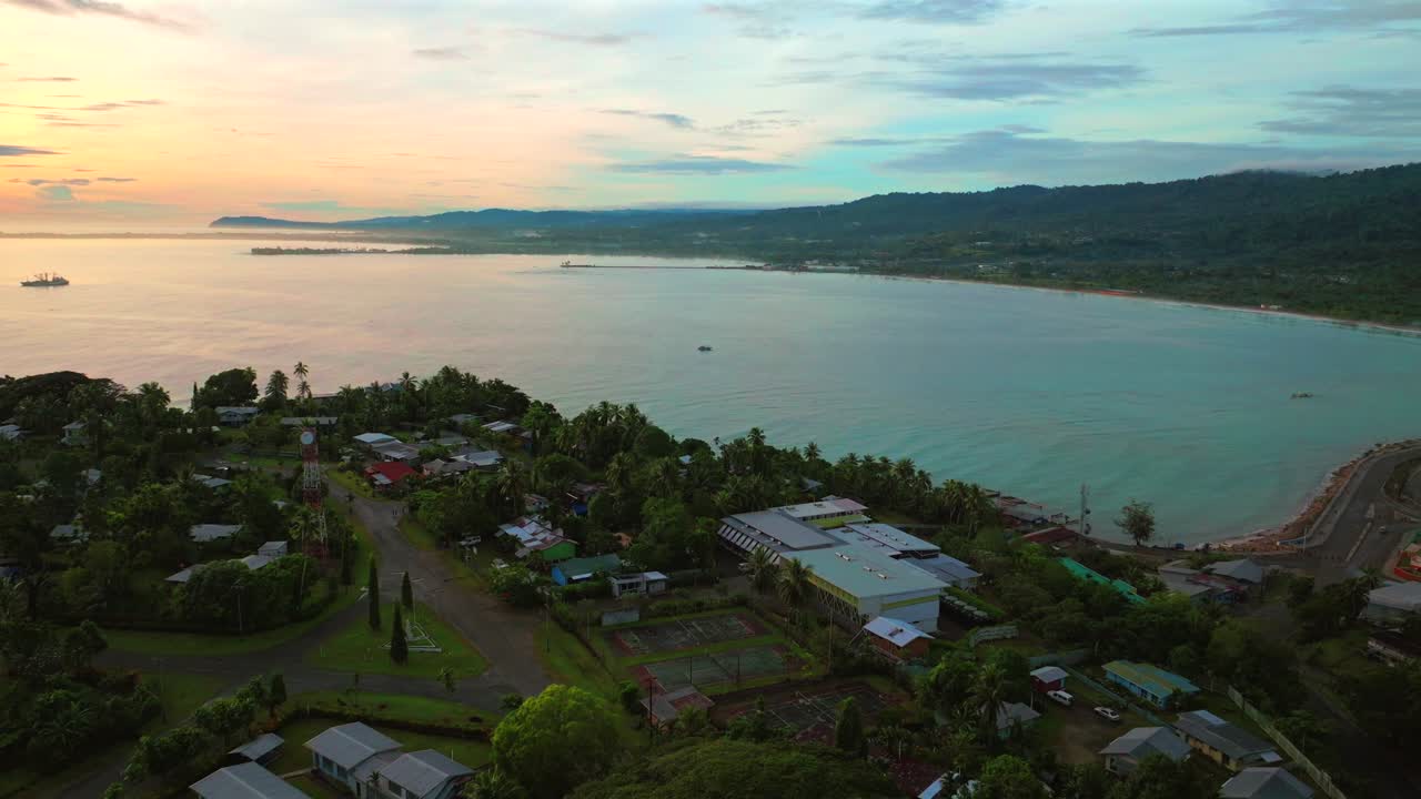 Vibrant sunrise morning Meni Beach Wewak Hill Wewak Port peninsula morning summer dry season Wewak costal town aerial drone Papua New Guinea PNG Dogreto Bay panoramic ocean view Boram Road backwards