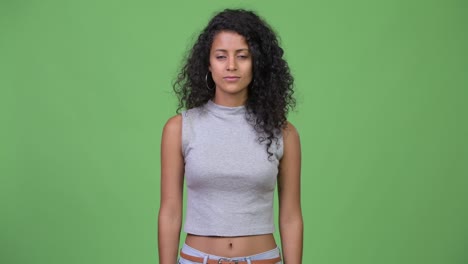young happy beautiful hispanic woman with curly hair