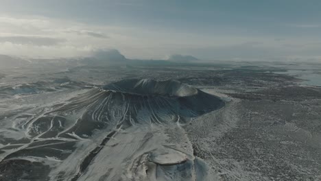 iceland's hverfjall volcanic crater covered in snow in the winter - aerial