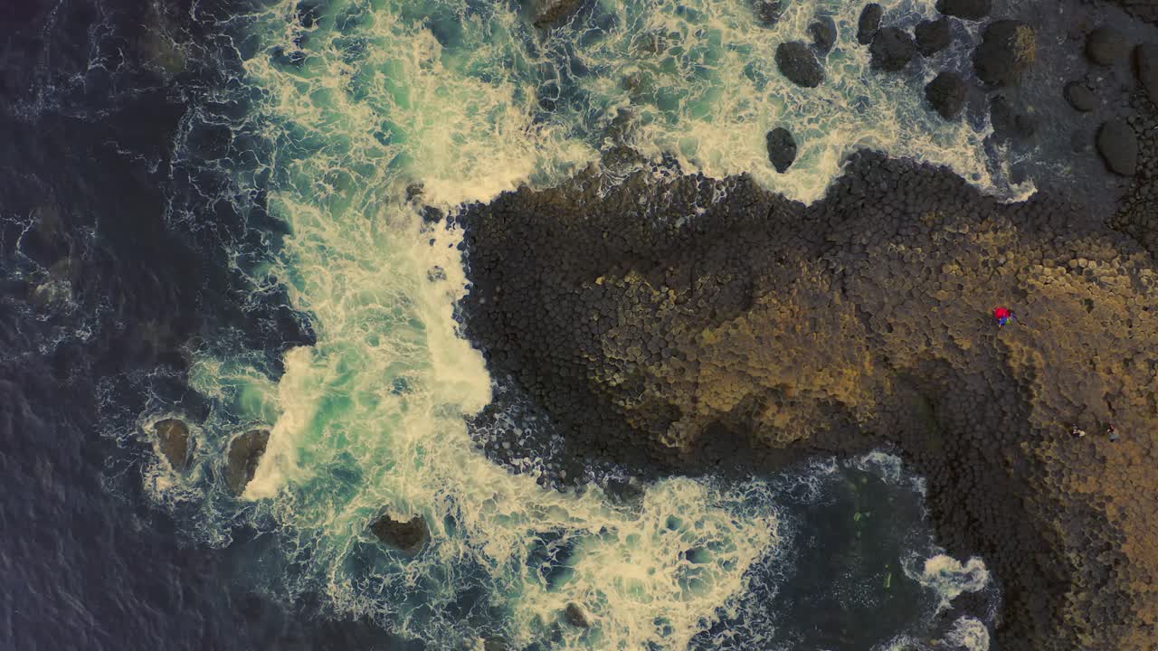 Aerial View of Giant's Causeway with Waves Crashing on the Rocks