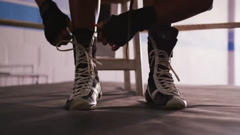 Close-up-view-of-woman-tying-her-shoelaces