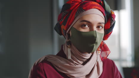 portrait of muslim female office worker in hijab and mask