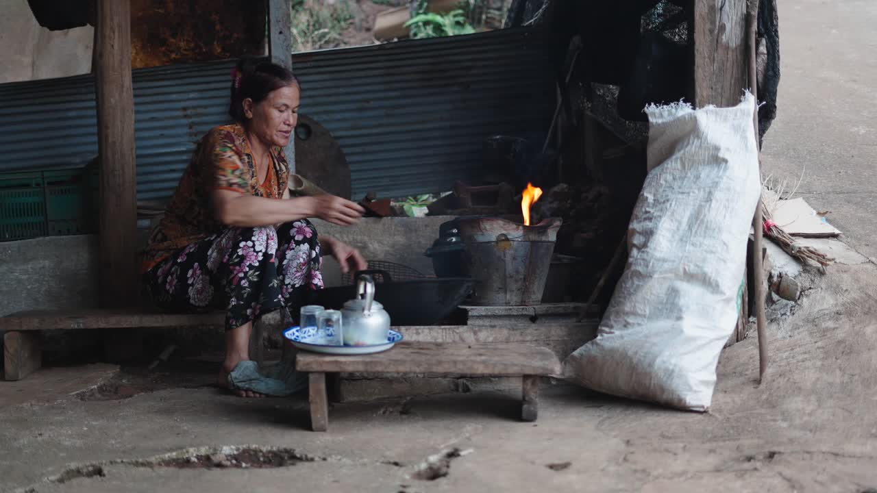 Woman Cooking Traditional Food in Rural Setting