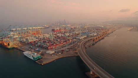 Cinematic-Shot-Of-Algeciras-Shipping-Port-Near-Suspended-Long-Bridge,-Spain