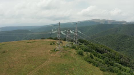 aerial view of transmission towers in georgian mountains