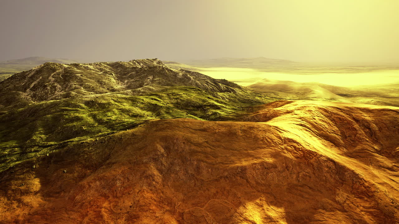 Mountain landscape bathed in warm light during golden hour over green hills