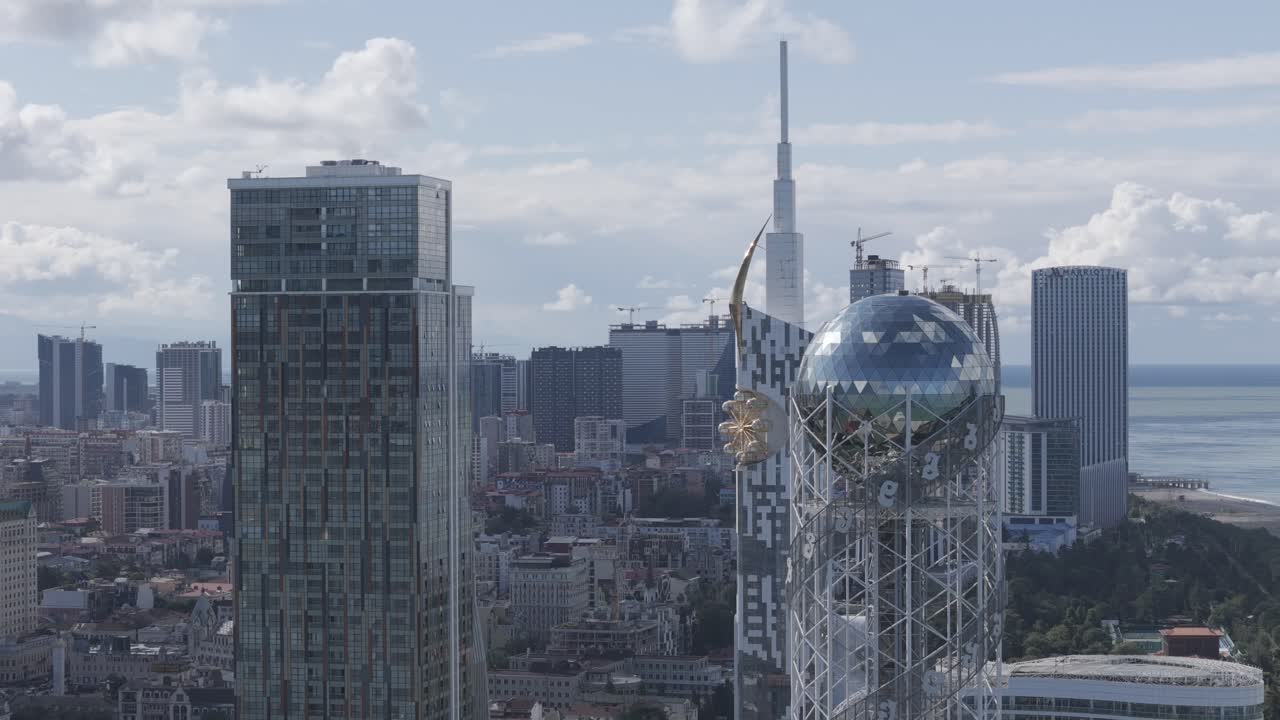 Cinematic daytime drone footage of Batumi skyline and skyscrapers.