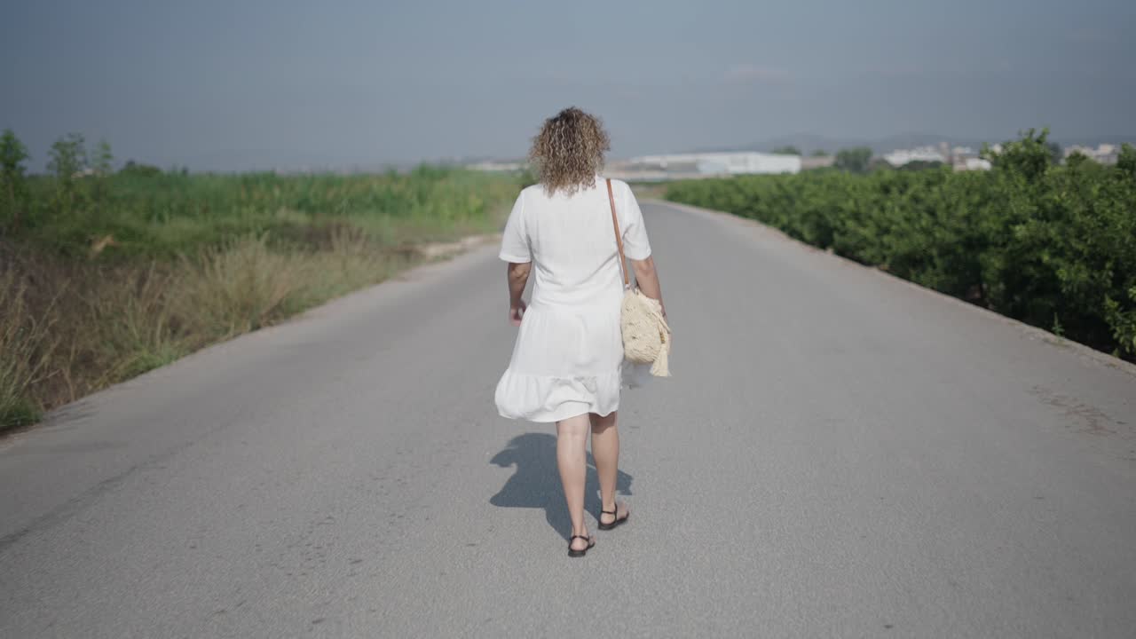 Woman Walking Country Road
