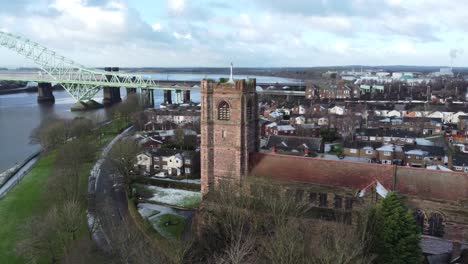 aerial view industrial small town jubilee bridge frosty church rooftops neighbourhood north west england orbit left