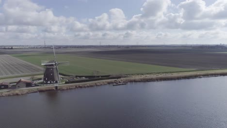 Drone-shot-of--Dutch-windmill-and-farmland