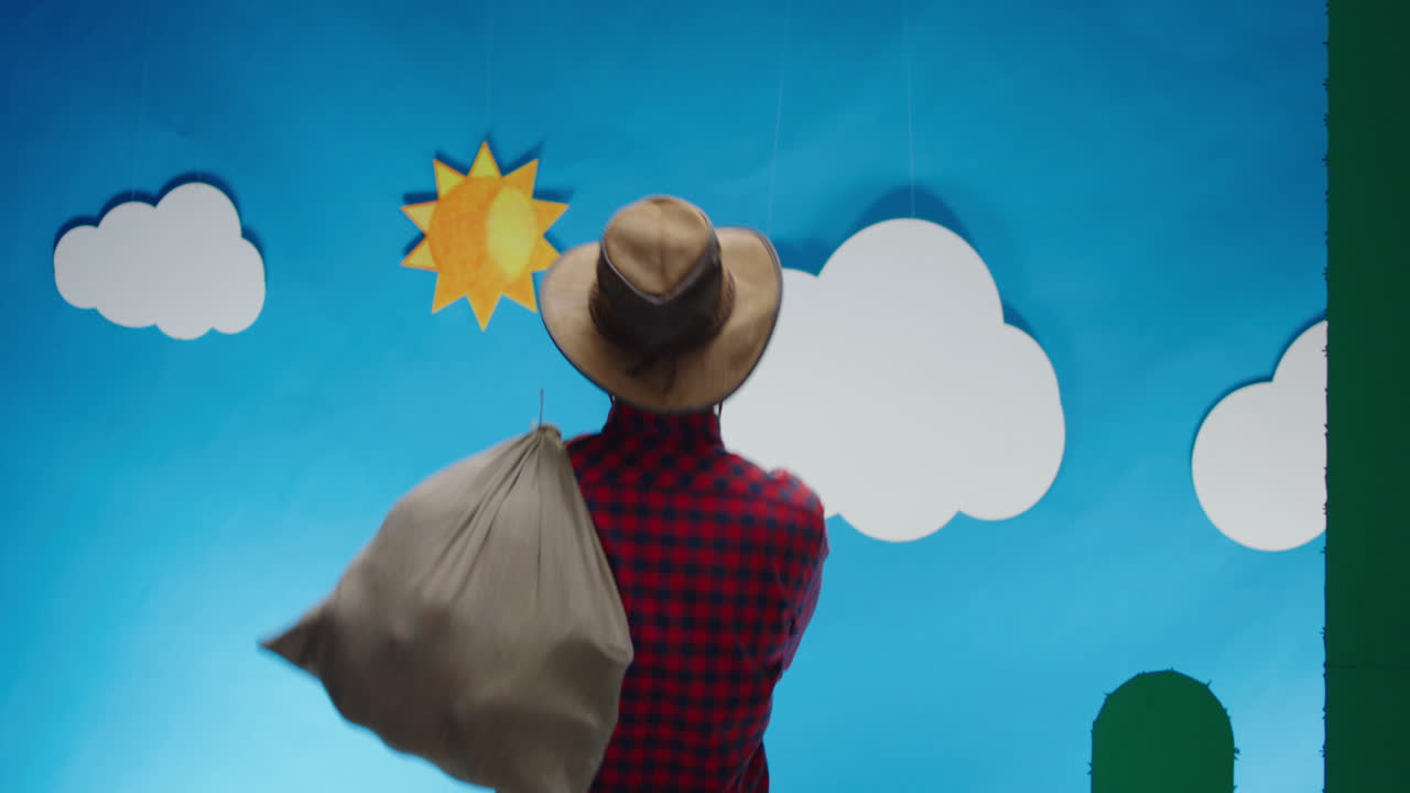 Cowboy Carrying a Bag in a Cartoon Desert Landscape