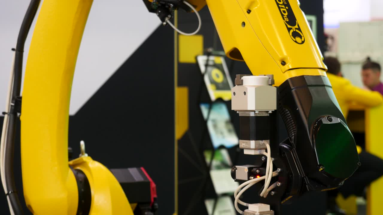 Robot arm working on a camshaft