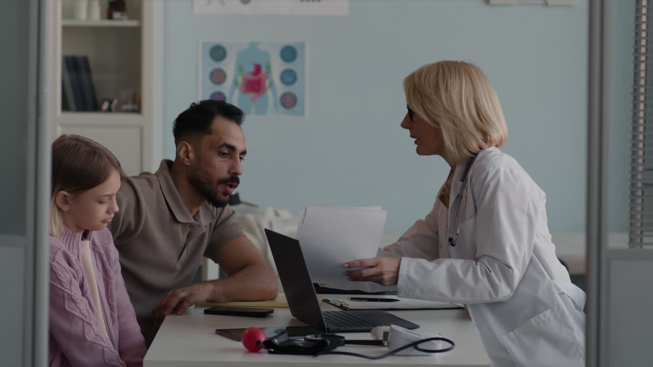 Medical consultation with a doctor and patient