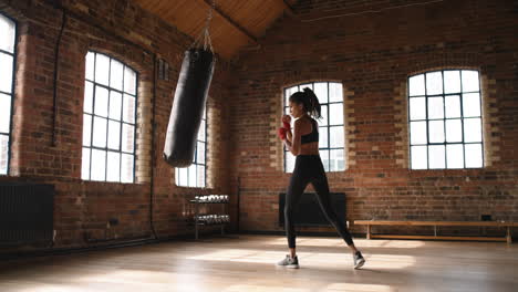 Hispanic-young-fit-woman-boxing