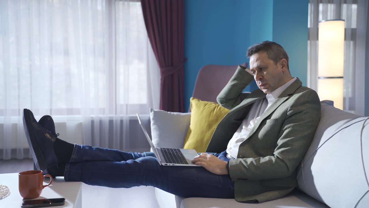 Stressed and depressed man receives news that he will be surprised and disappointed at home.