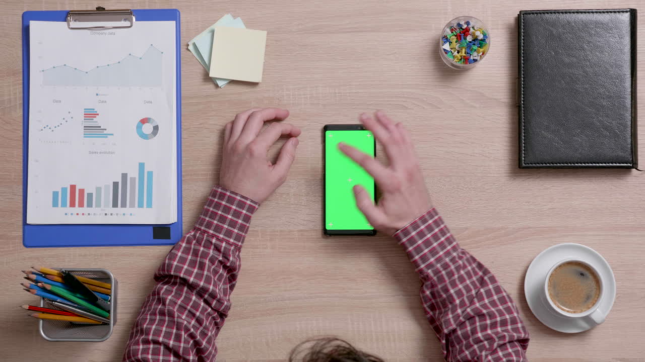 Office Desk with Smartphone and Business Reports