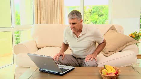 Man-delighted-with-something-on-laptop