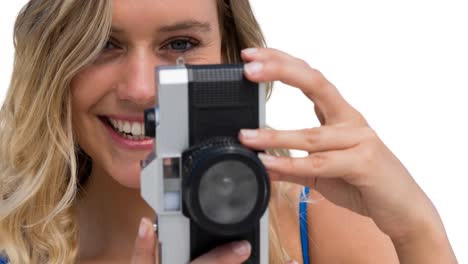 animation of happy caucasian woman holding camera over white background