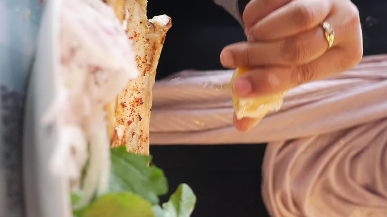 Preparing a dish with lemon