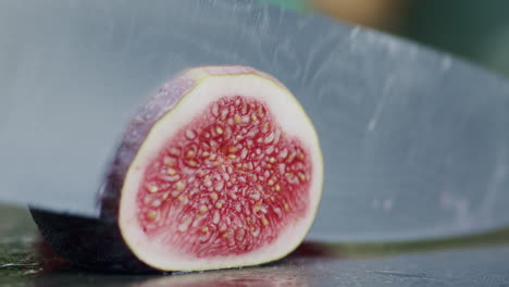 close-up of slicing a fresh fig