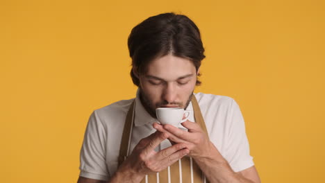 caucasian man in front of camera on yellow background.