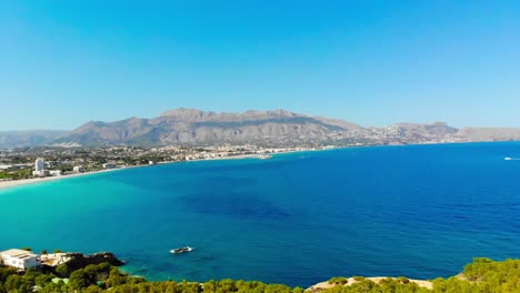 Drone-footage-from-Costa-Blanca,-capturing-the-forest,-sea-and-mountains-in-the-same-video