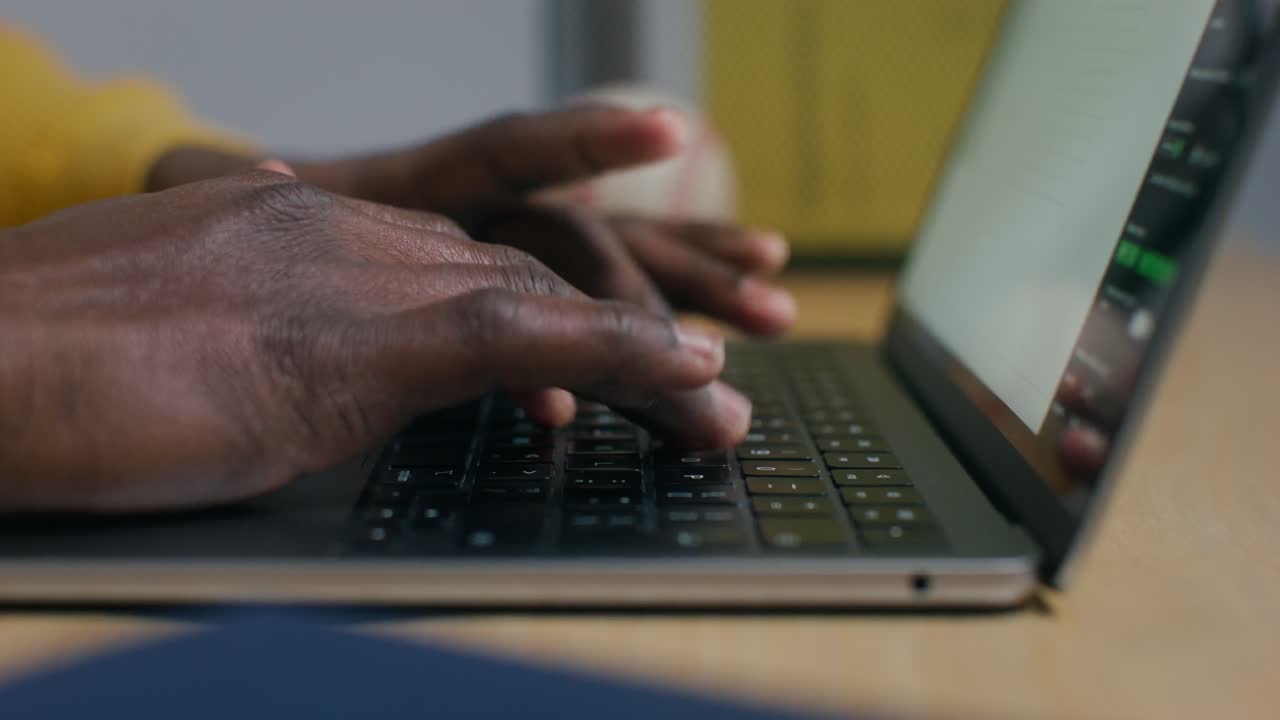 Person Typing on a Laptop