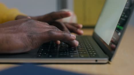 person typing on a laptop