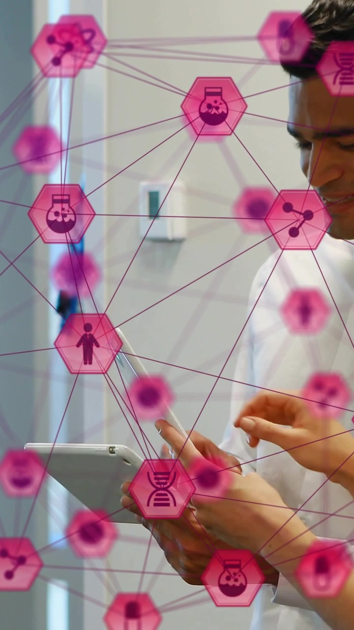 Vertical video: Two medics tapping tablet to view clinical data, pink hex net overlaying hands