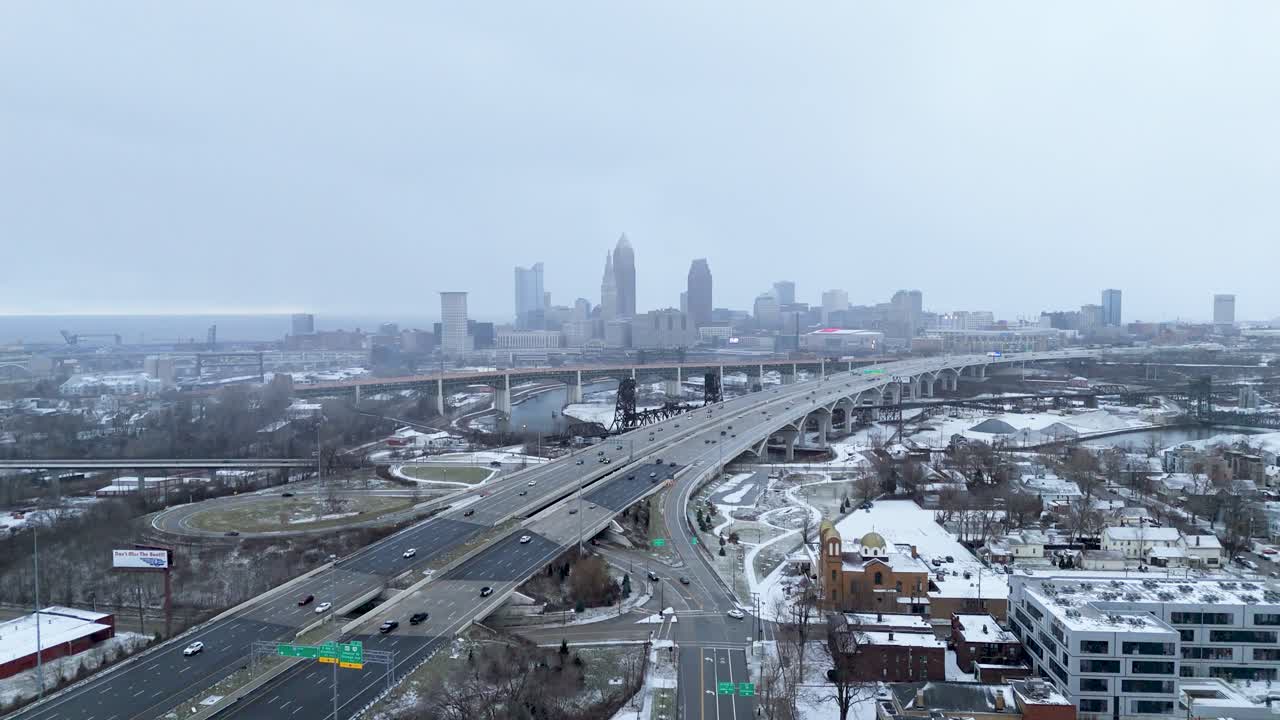 Aerial shot pulling out from a Downtown Cleveland, Ohio and I90 winter skyline.