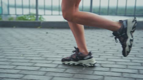 Running shoes on pavement