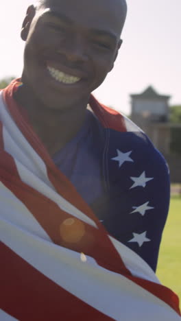 athlete holding american flag