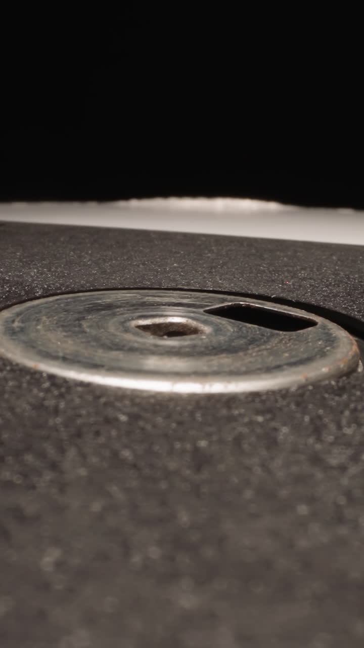 Modern floppy disk for watching eclipses on black background. Professional data storage device designed for recording and transferring information macro