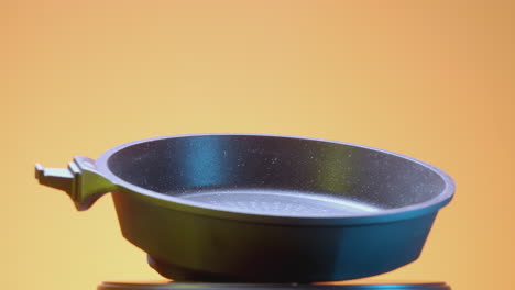 empty grey non-stick frying pan