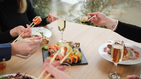 friends enjoying sushi dinner