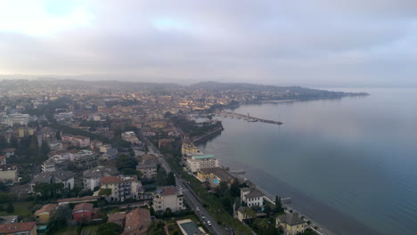 Drone-aerial-view-flies-over-Italian-city-on-Lake-Garda