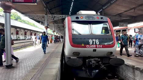 sri lankan commuter train at a railway station