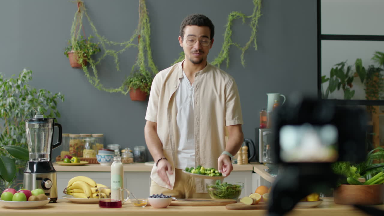 Food Blogger Filming Vegan Recipe with Camera