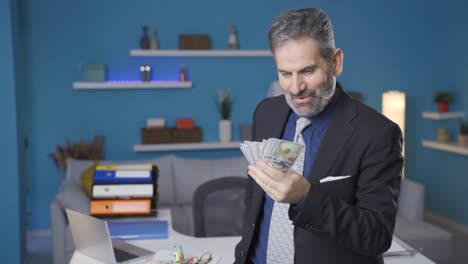 funny and entertaining businessman counts the money he earns, the businessman who earns a lot rejoices.