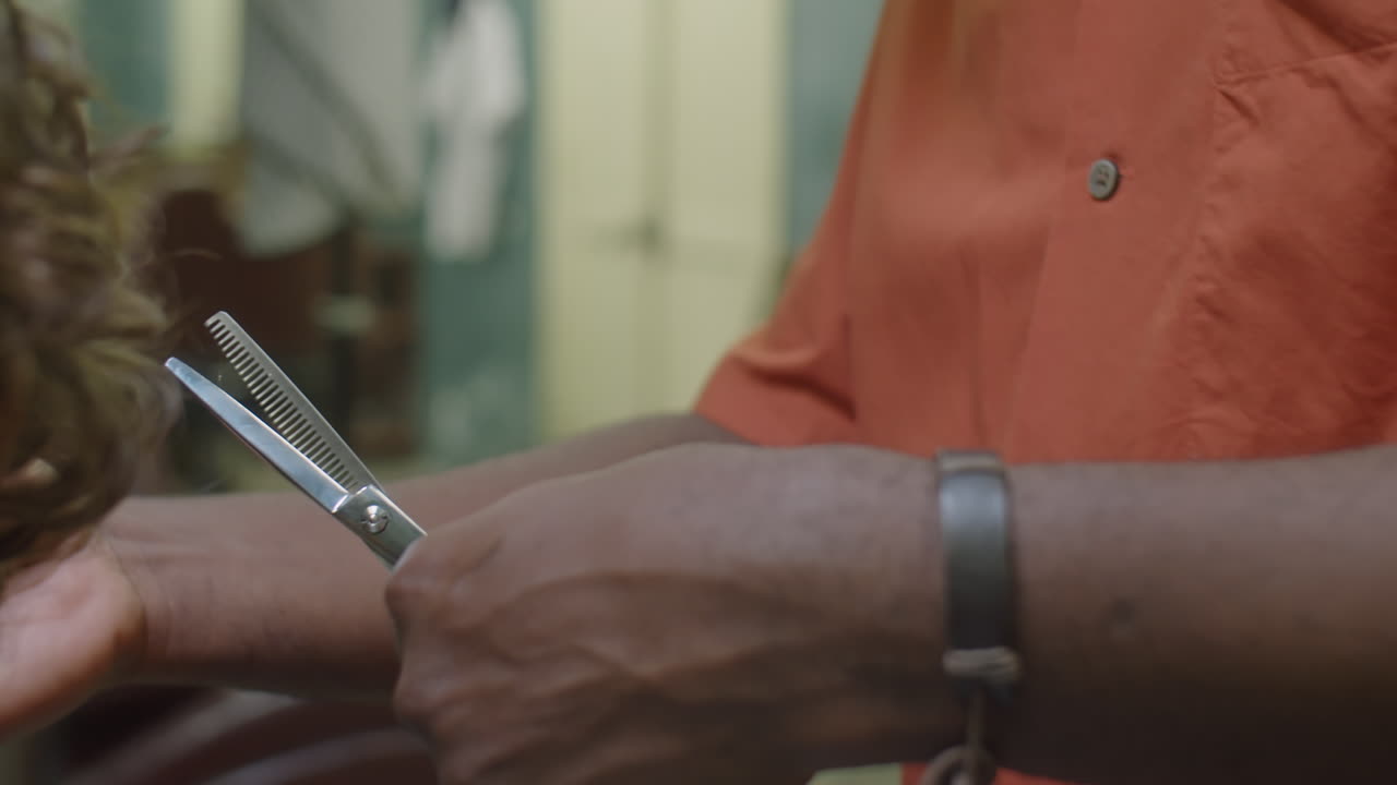 Barber Cutting Hair of Client with Thinning Shears