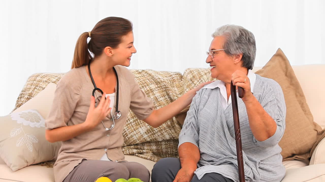 Nurse visiting her mature patient