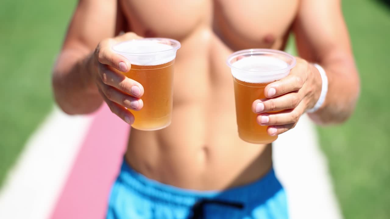 Man holding two beers