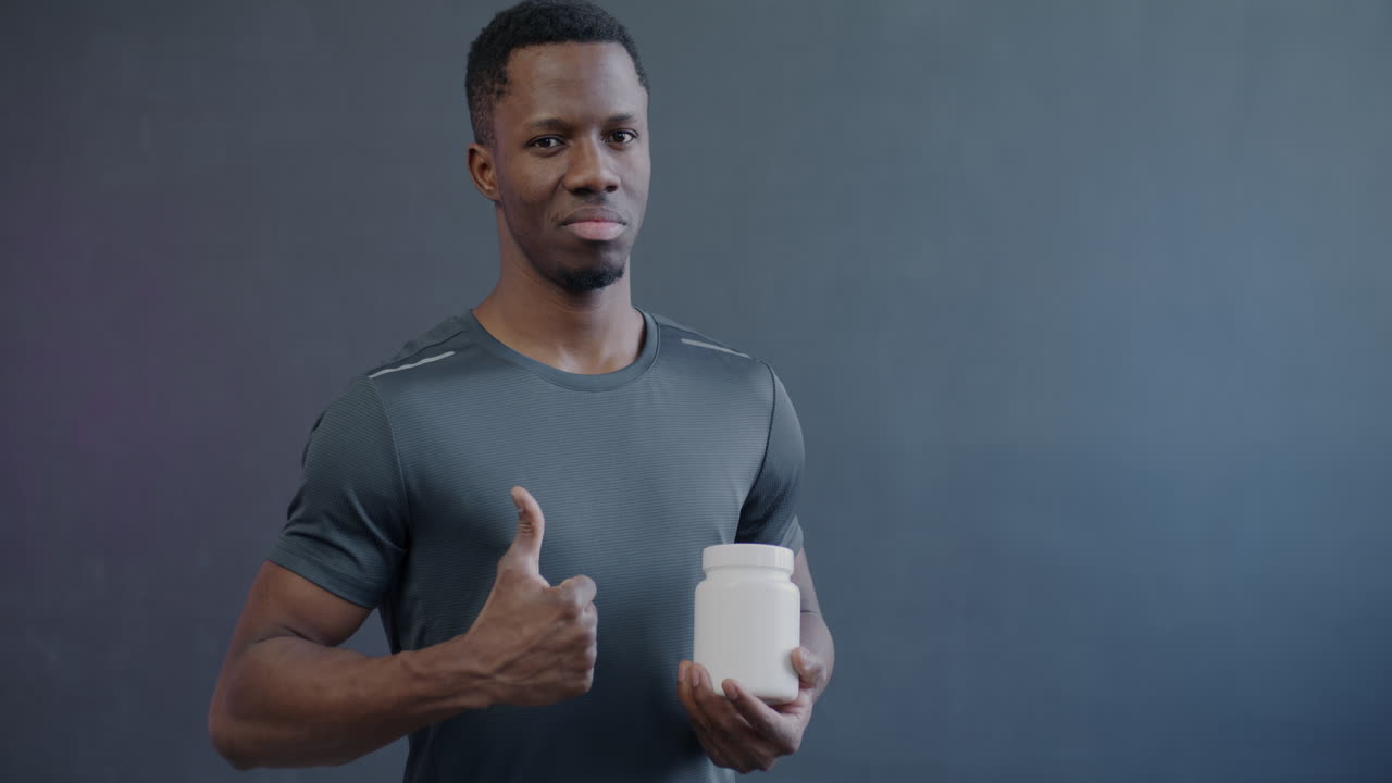 Man holding a supplement container