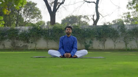 butterfly yoga pose demonstrated by an indian man