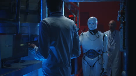 scientists and a robot in a laboratory setting