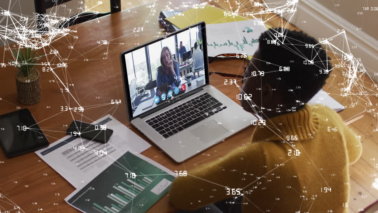 African American woman networks globally from home via videocall for business.