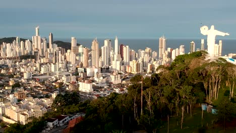 Christ-the-redeemer-on-top-of-a-hill-and-the-city-in-background