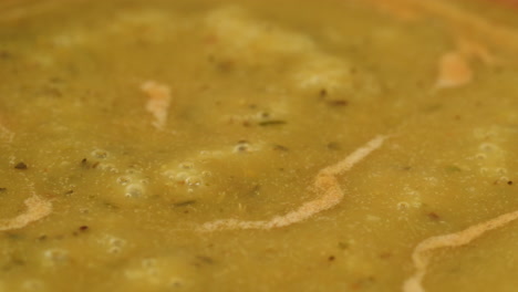 cooking traditional indian meal palak panir with spinach and cheese close up. palak paneer is an indian dish, consisting of paneer in a thick paste made from pureed spinach, palak paneer is prepared by first boiling and pureeing spinach.