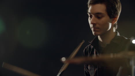 slow motion sequence of drummer playing drum kit