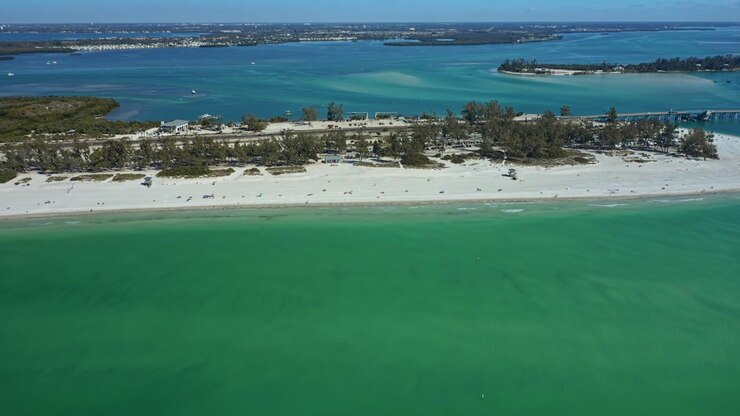 A sweeping coastal scene showcasing Bradenton Beach's vibrant waters and distant islands.